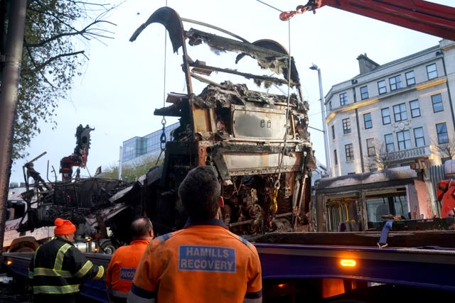 A burned out bus is removed from O’Connell Street in Dublin