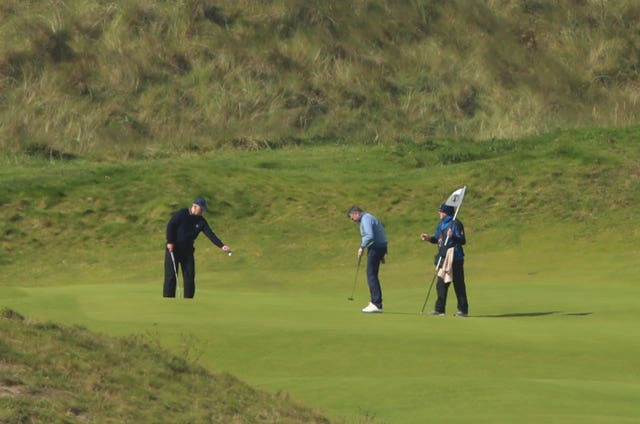 The Duke of York (left) with Gary McNeill (centre), Royal Portrush head professional