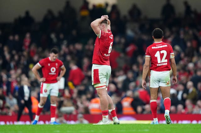 Wales’ Taine Plumtree and team-mates appear dejected after the match 