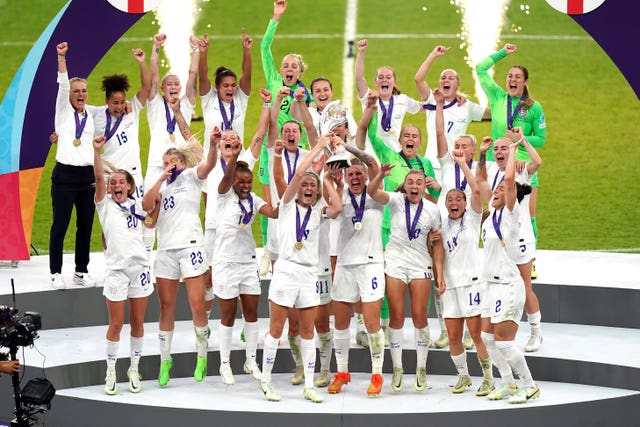 England’s Leah Williamson and Millie Bright lift the trophy at Wembley