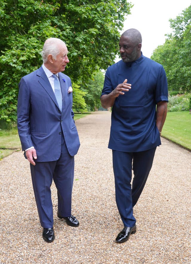 The King and Idris Elba discuss youth opportunity (Yui Mok/PA)