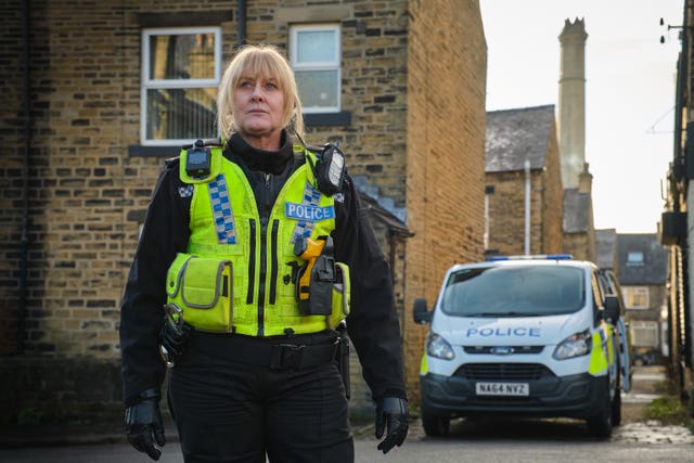 Sarah Lancashire as Sergeant Catherine Cawood, dressed in police uniform