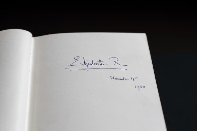 The signature of Queen Elizabeth II is seen in one of three Downing Street Visitors Books at the National Archives