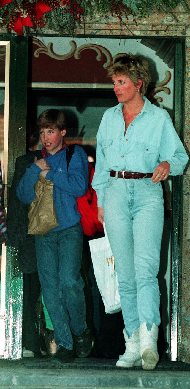 Diana carries a bag for her son, Prince William, as they leave the Arlberg Hotel in Lech, Austria