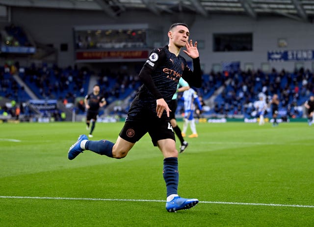 Manchester City’s Phil Foden celebrates scoring at the AMEX Stadium, Brighton