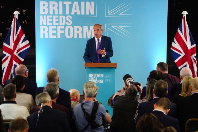 Reform UK leader Nigel Farage stands on a podium launching Our Contract With You 