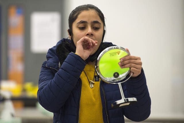 A student takes a Lateral Flow Test at Hounslow Kingsley Academy (Kirsty O'Connor/PA)