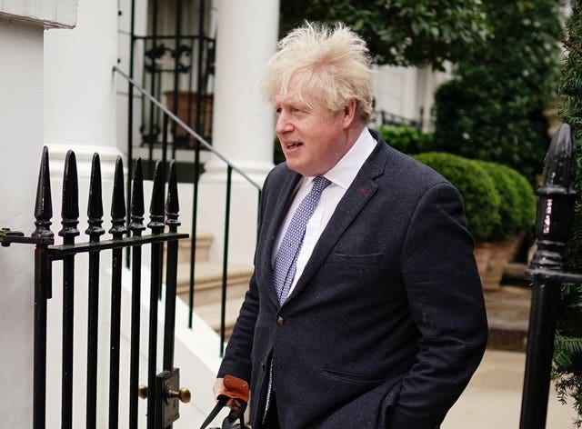Former prime minister Boris Johnson leaves his home in London on Tuesday