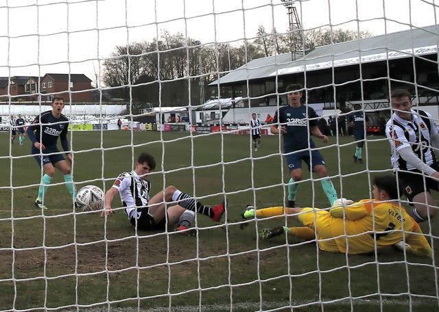 Chorley's Mike Calveley, second left, scores his side's second goal in their third-round win against Derby