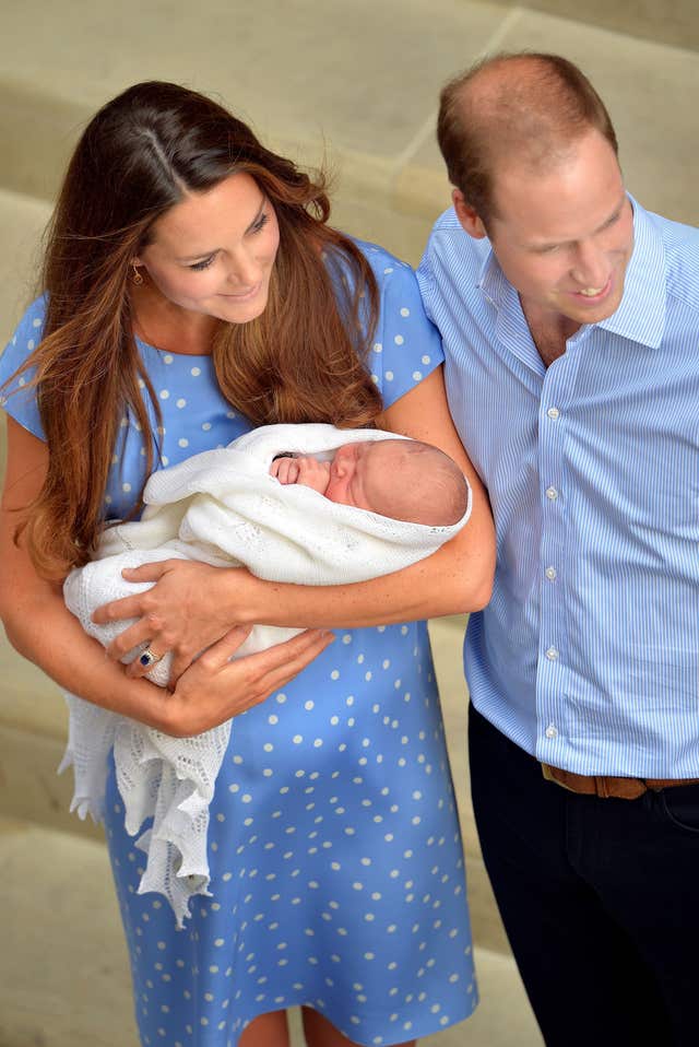 The Duchess of Cambridge with her husband the Duke of Cambridge and their her son Prince George (John Stillwell/PA)