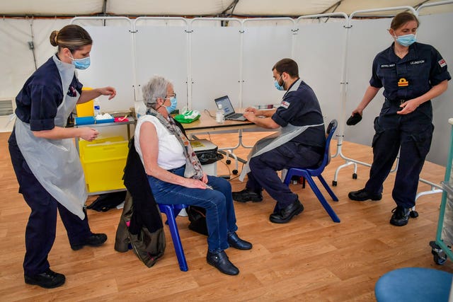 Royal Navy personnel administer the Oxford-AstraZeneca vaccine (Ben Birchall/PA)