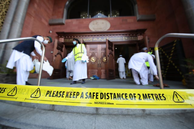 Worshippers observe social distancing as they arrive at the Bradford Grand Mosque 