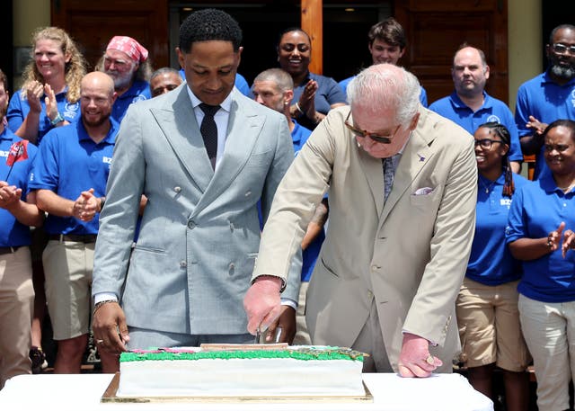 The King cuts a cake to mark the centenary of the Bermuda Aquarium Museum
