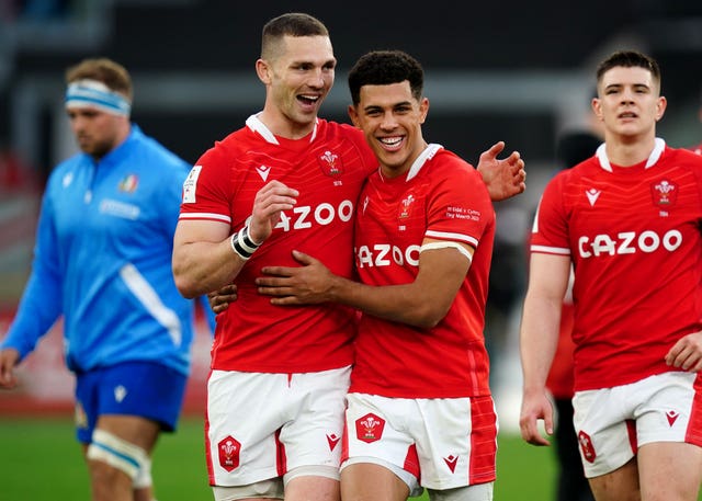 George North (left) and Rio Dyer (right) celebrate Wales' win in Italy