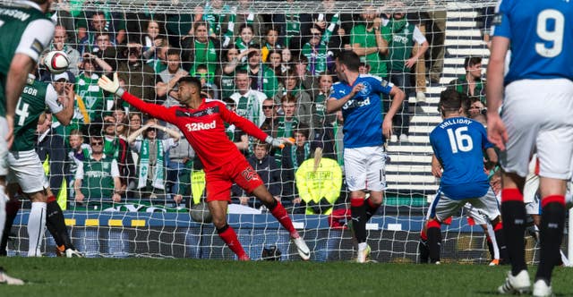 Hibernian's David Gray (obscured) scores against Rangers 