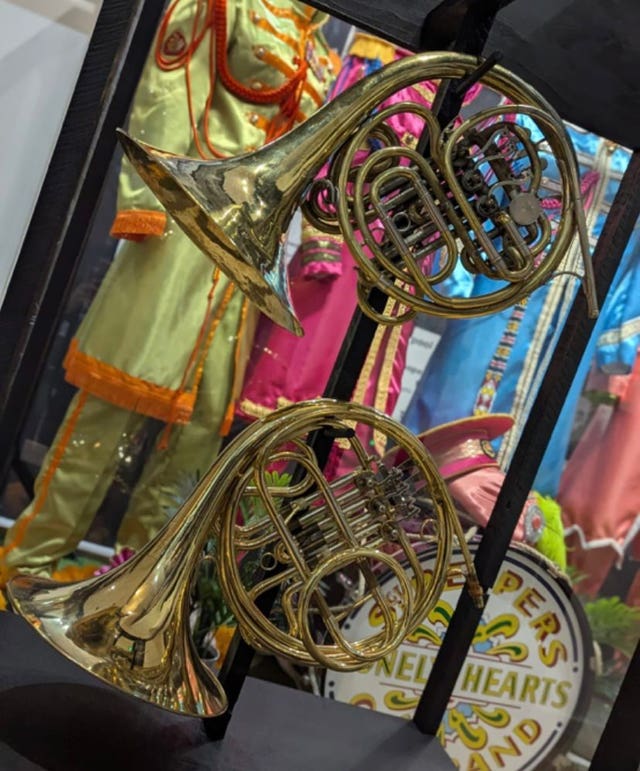 Two of the four French horns used on Sgt. Pepper's