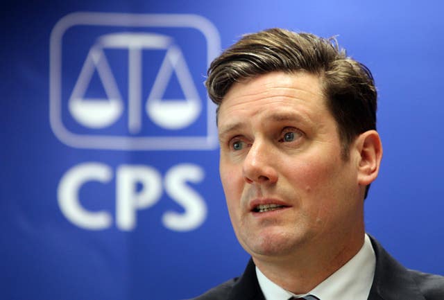 A younger Keir Starmer next to the Crown Prosecution Service - the scales of justice above 