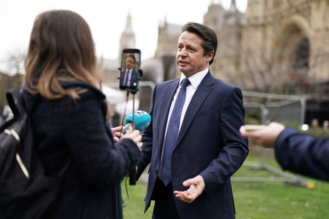 Nigel Huddleston speaks to reporters