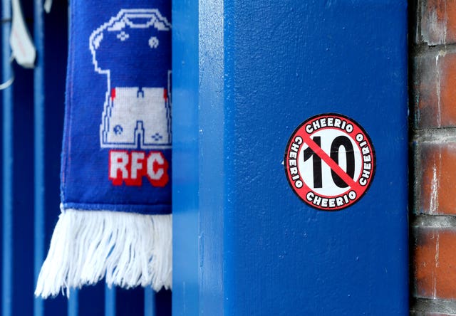A sticker on a gate at Ibrox referencing Celtic's attempt to win 10 Scottish Premiership titles in a row