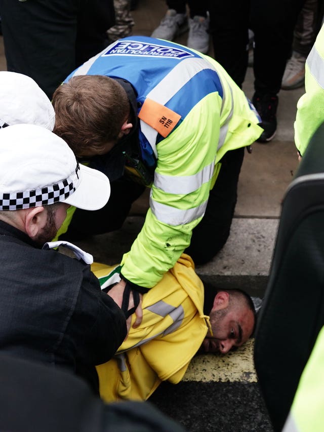 Police detaining a man