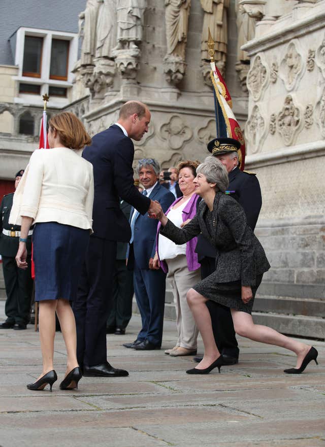 Theresa May curtsying to the Duke of Cambridge