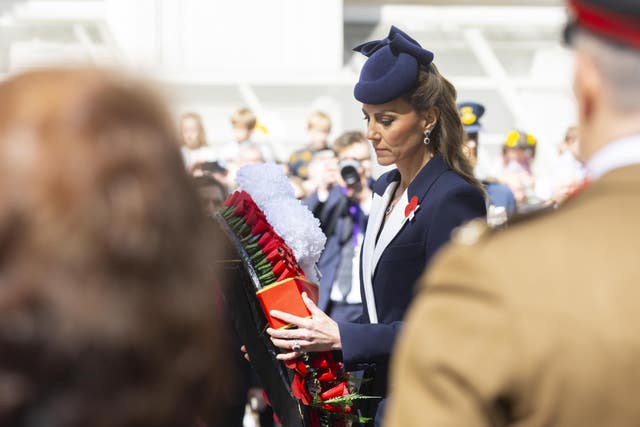 The Princess of Wales holding the wreath 