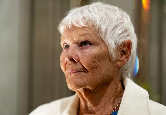 Dame Judi Dench sits for a sculptor