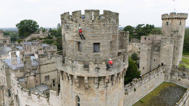 Two people abseilers on Warwick Castle