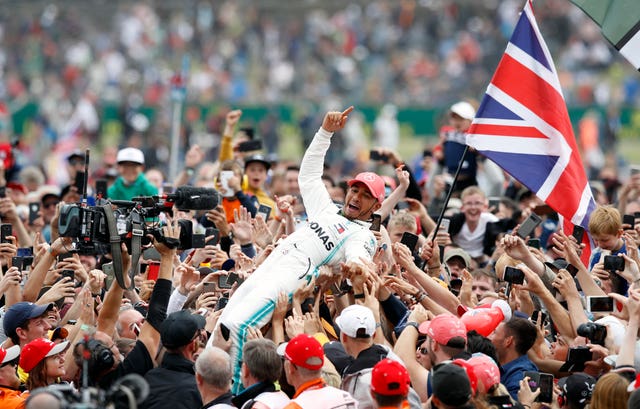 Hamilton is held aloft after winning the race for a record sixth time
