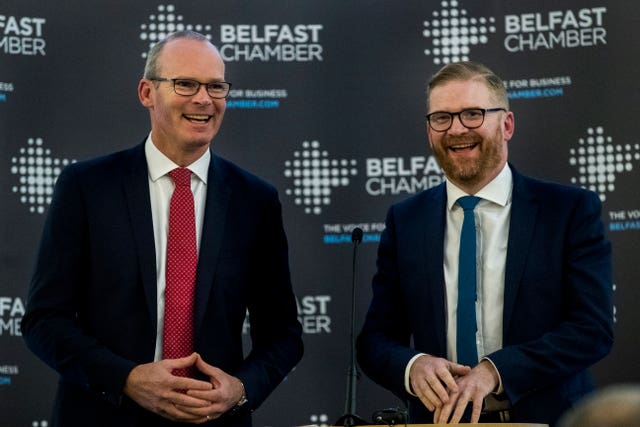 Mr Coveney, left, with Belfast Chamber chief executive Simon Hamilton