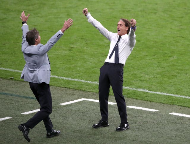 Roberto Mancini (right) celebrates after Italy reach the last eight of Euro 2020 with an extra-time win over Austria 