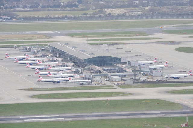 Planes lined up at departure gates at Heathrow