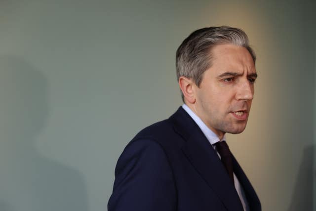 Side view head and shoulders photo of Simon Harris