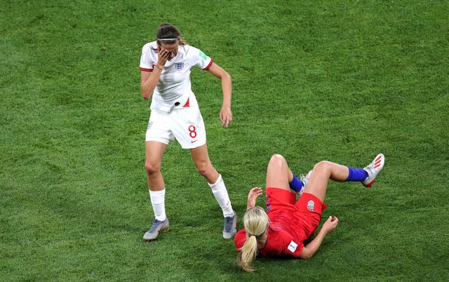 Scott, left, and Lindsey Horan, right, come together in midfield