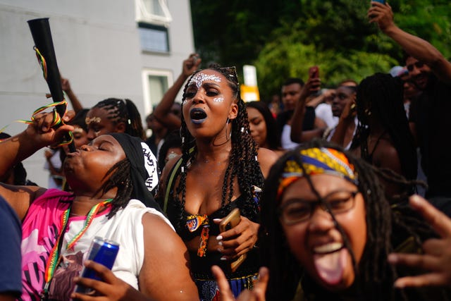 Carnival-goers during the family day at the Notting Hill Carnival in London