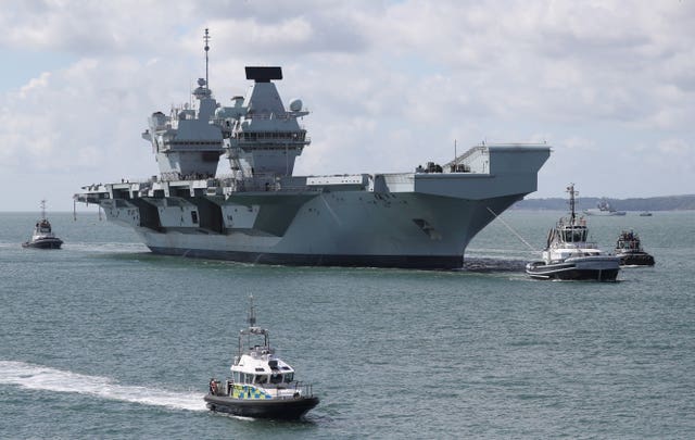 The Royal Navy aircraft carrier HMS Queen Elizabeth (Andrew Matthews/PA)