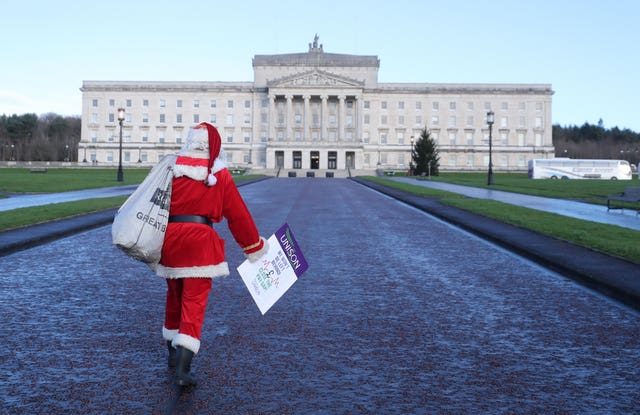 A member of the Health Union Unison protests on the issue of nurses' pay at Stormont