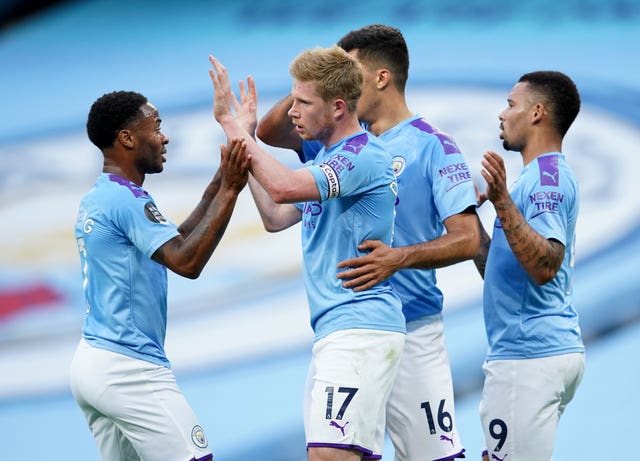 Kevin De Bruyne, centre, celebrates his goal against Liverpool 