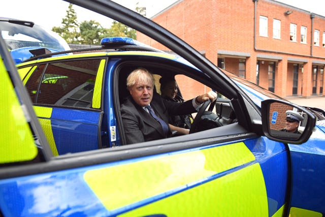 Prime Minister Boris Johnson sitting in the driver’s seat of a police vehicle during a visit to Northamptonshire Police Headquarters in Northampton (Stefan Rousseau/PA)