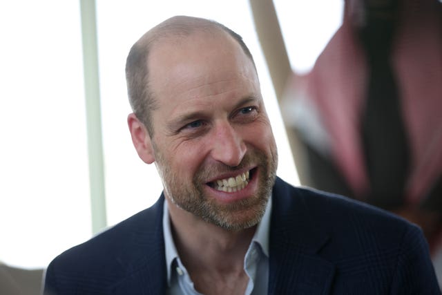 The Prince of Wales speaks with students during a visit to an environmentally sustainable urban regeneration programme at Sports Boulevard in Riyadh