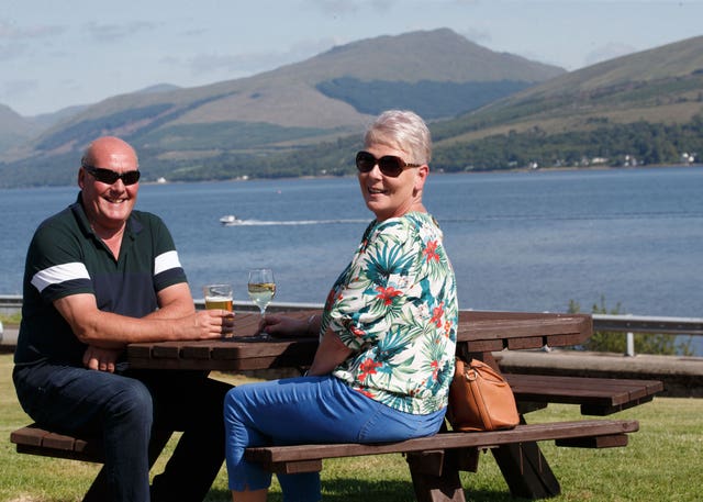 Caroline Hedley, 57, an auxiliary nurse at Hawick Community Hospital, enjoys the view with her husband David at the Loch Fyne Hotel and Spa in Inveraray, Argyll and Bute 