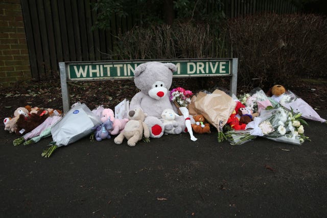 Flowers and soft toys left near the scene of a house fire in Sycamore Lane, Stafford