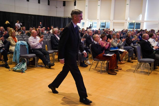 Jacob Rees-Mogg walks up to give a speech during the Conservative Democratic Organisation conference at Bournemouth International Centre 