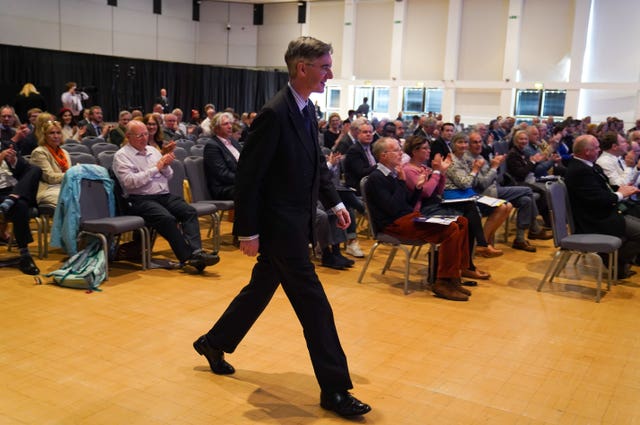Jacob Rees-Mogg walks up to give a speech during the Conservative Democratic Organisation conference at Bournemouth International Centre
