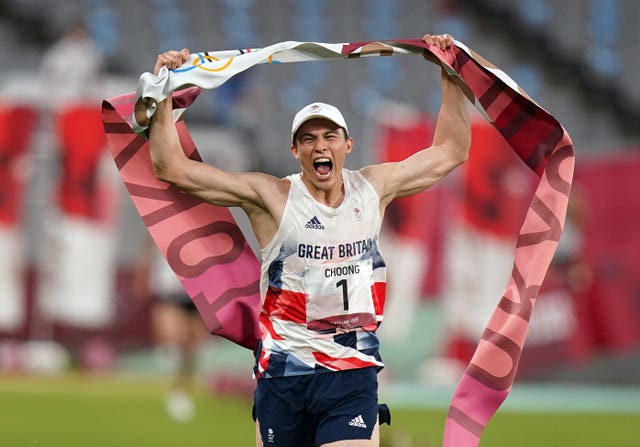 Joseph Choong crosses the finish line to claim victory in the modern pentathlon in Tokyo. The Kent athlete became the first ever Great Briton to win gold in the five-sport event