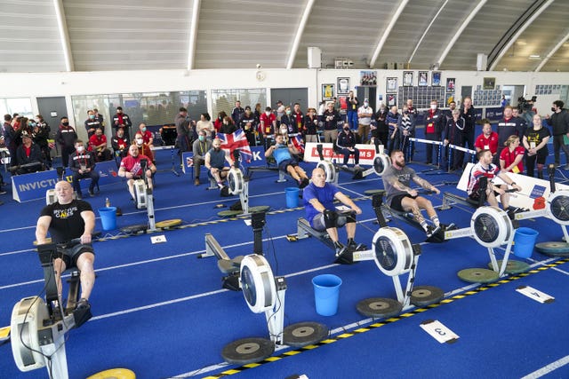 Members of Team UK in a group training session on rowing machines