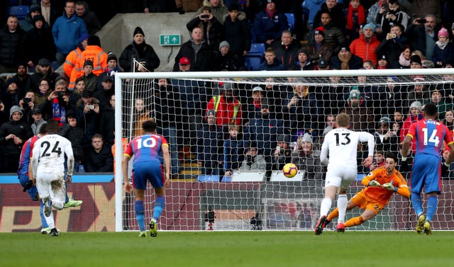 Luka Milivojevic, left, scores Palace's first goal from a penalty