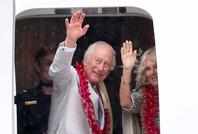 The King and Queen waving