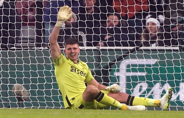 Newcastle keeper Nick Pope signals to the bench after injuring his shoulder