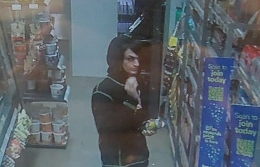 CCTV still of Marc Drostle in a shop